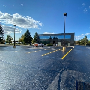 Image depicts a parking lot with newly painted traffic lines.