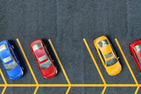 cars on asphalt sealcoat parking lot