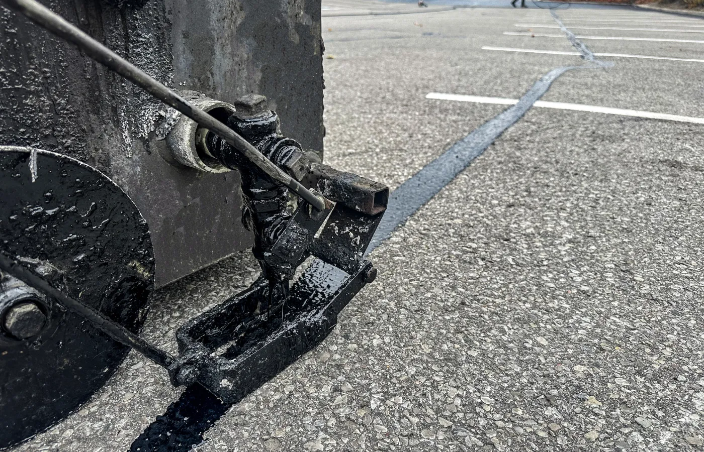 cured asphalt driveway after crack filling
