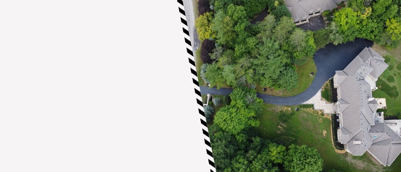 Image depicts a driveway that has been sealed as part of a driveway sealing King City project.