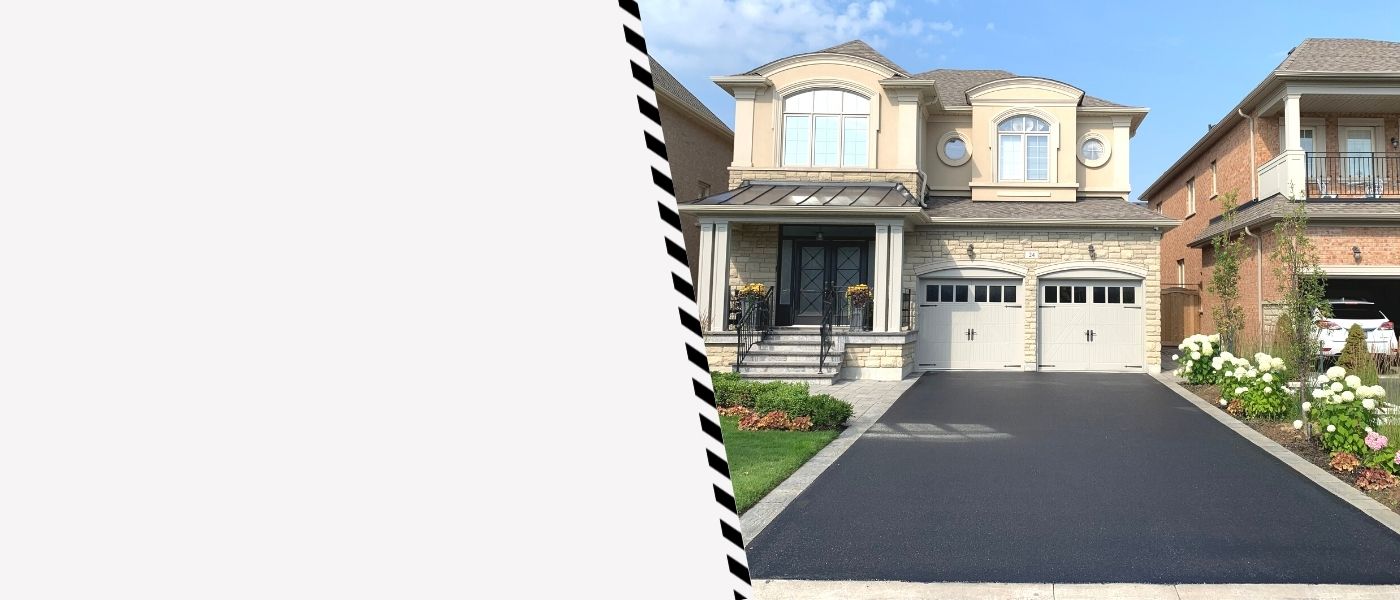 Image depicts a residential driveway as part of a driveway sealing project in Brampton done by AHS.