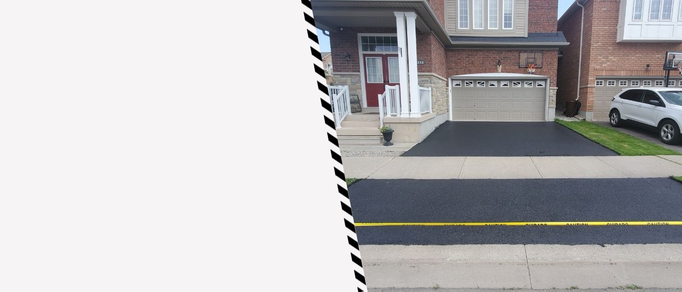 Image depicts a driveway that has been sealed as part of a driveway sealing Burlington project.