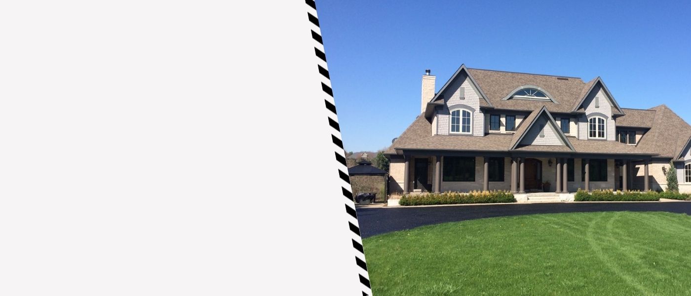 Image depicts a driveway that has been sealed as part of a driveway sealing Concord project.