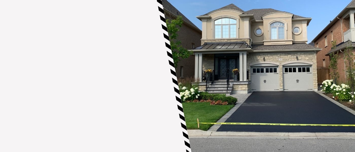 Image depicts a driveway that has been sealed as part of a driveway sealing Etobicoke project.