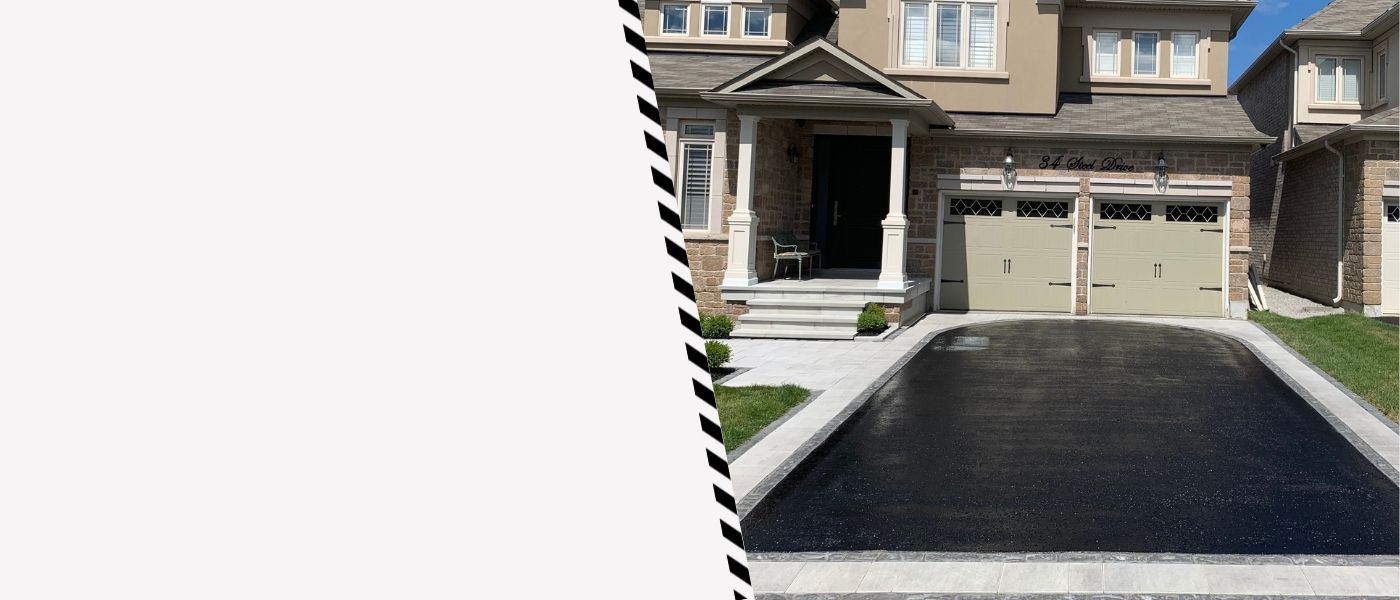 Image depicts a driveway that has been sealed as part of a driveway sealing Georgetown project.