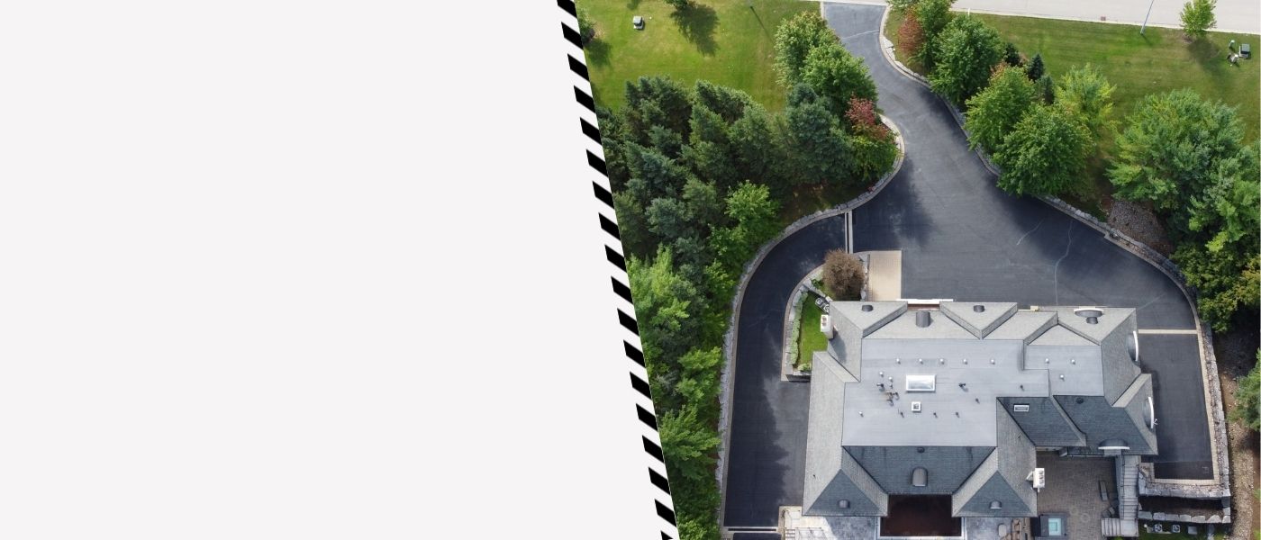 Image depicts a driveway that has been sealed as part of a driveway sealing GTA project.