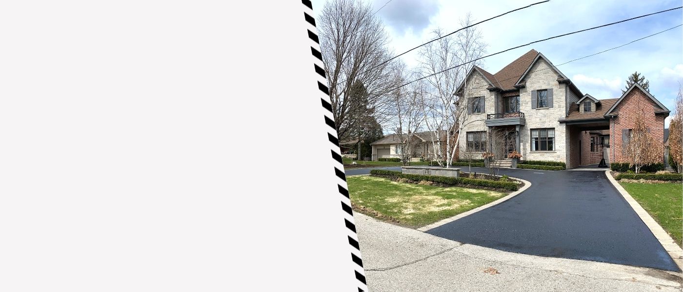 Image depicts a driveway that has been sealed as part of a driveway sealing Mississauga project.