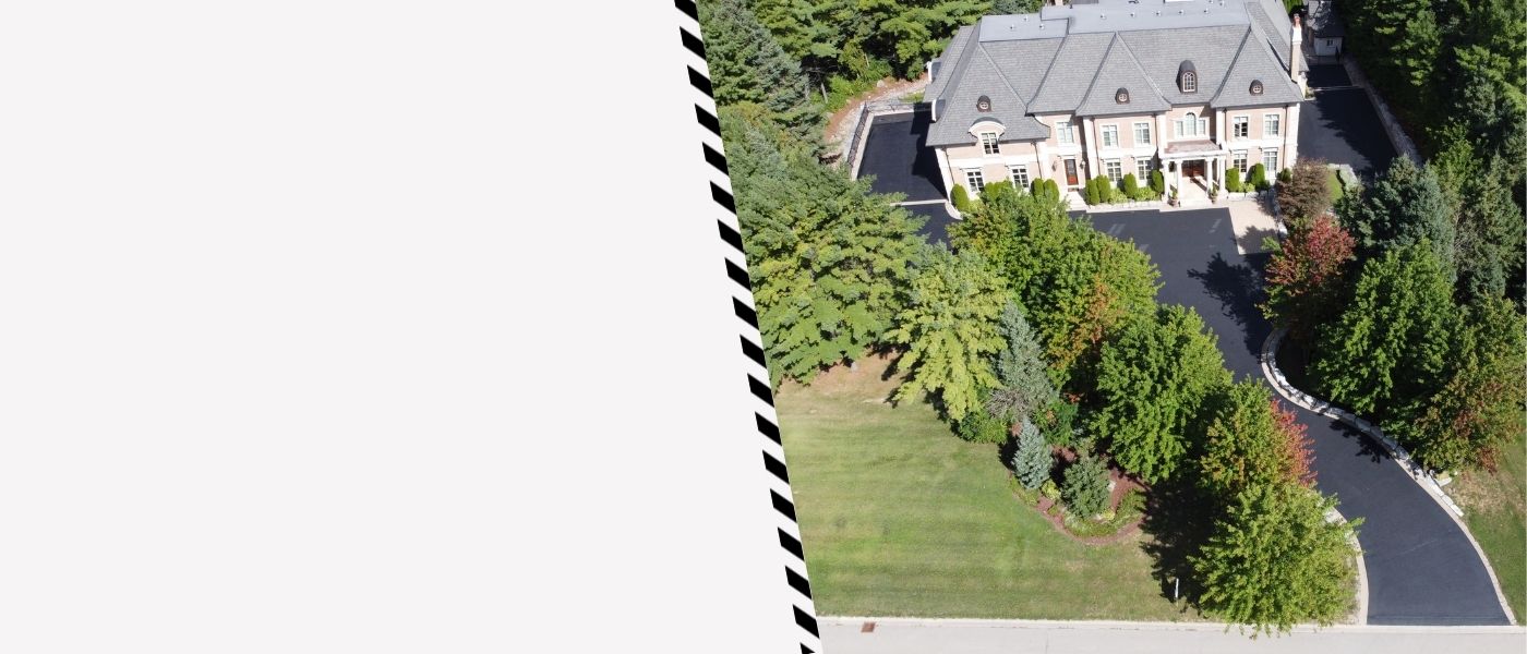 Image depicts a driveway that has been sealed as part of a driveway sealing Newmarket project.