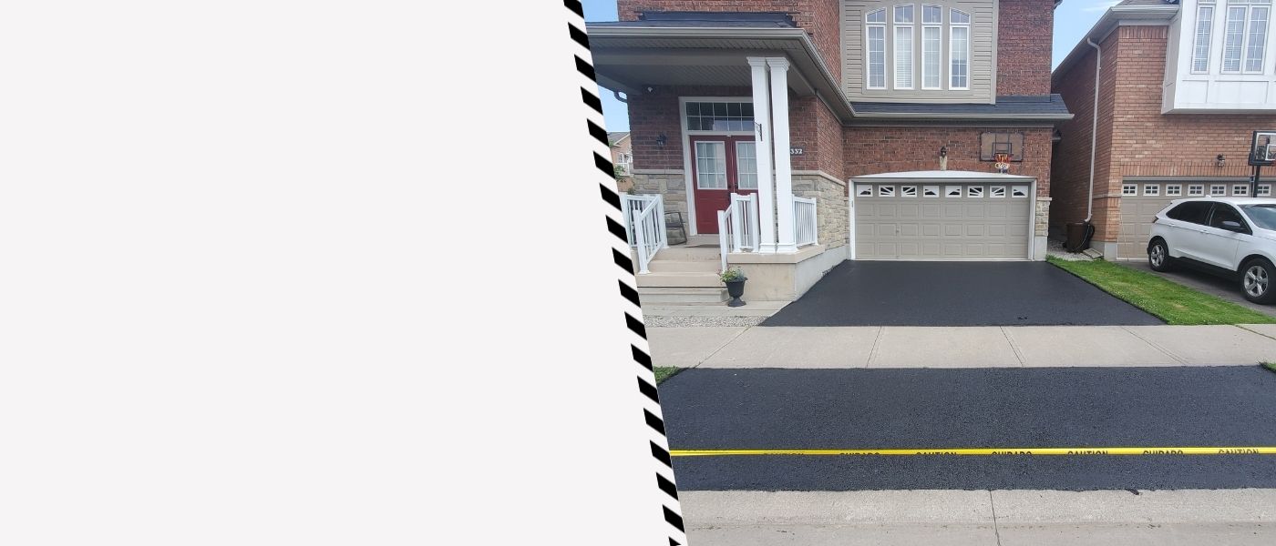 Image depicts a driveway that has been sealed as part of a driveway sealing Richmond Hill project.