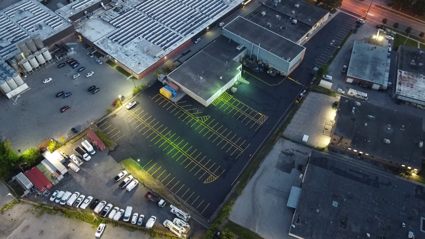 Commercial parking lot with sealed asphalt and new line painting.