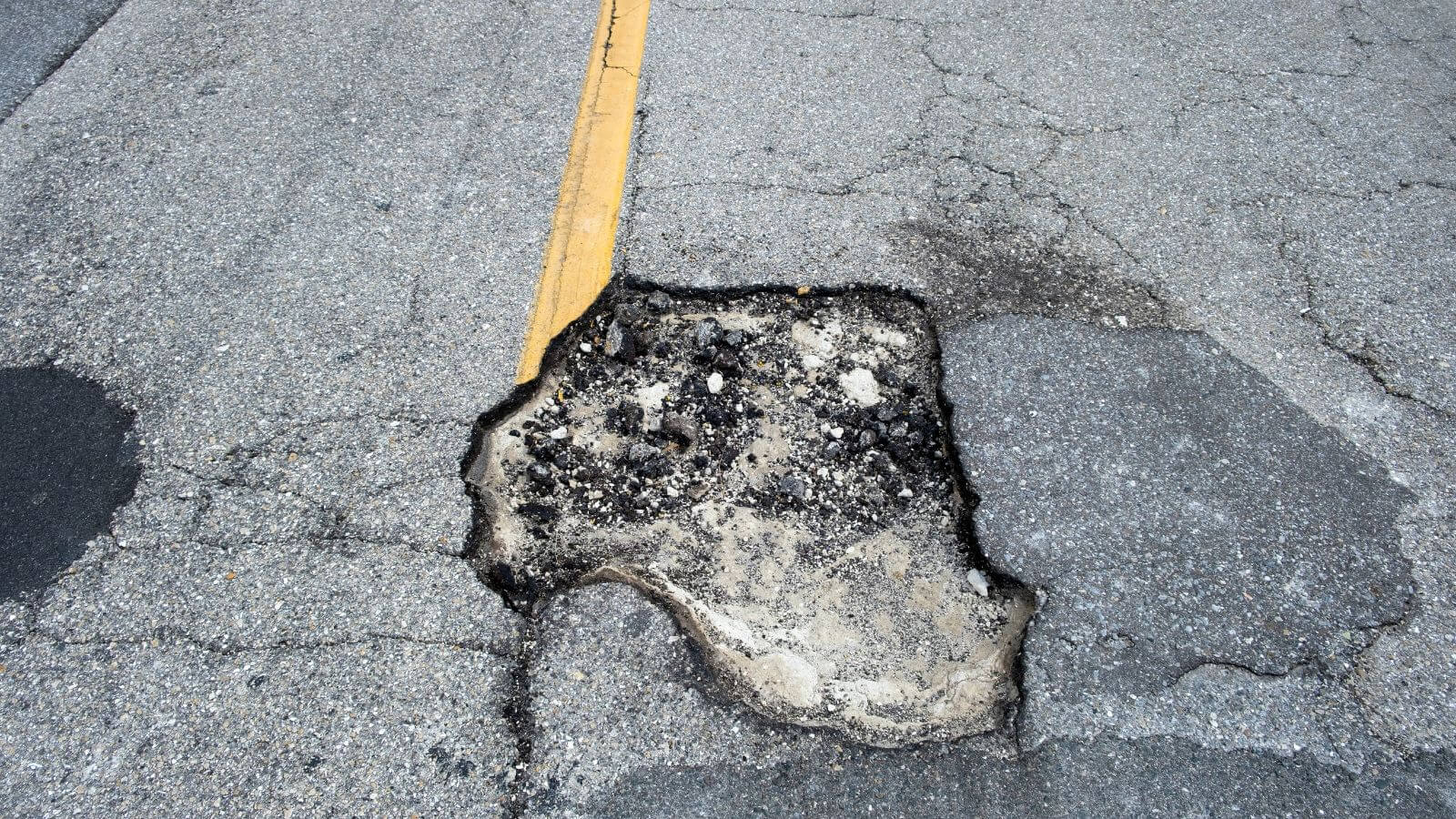 pothole in asphalt road