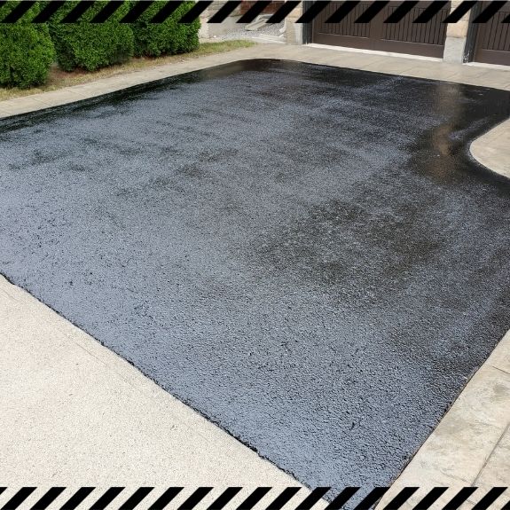 Image depicts a driveway that has been sealed as part of a driveway sealing Schomberg project.