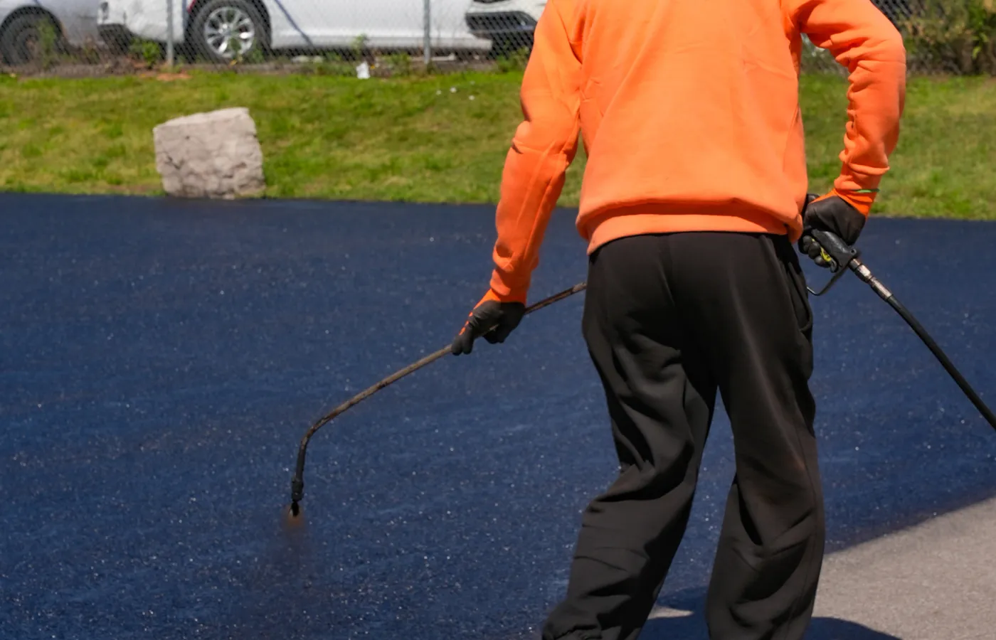 spraying vs brushing driveway sealing